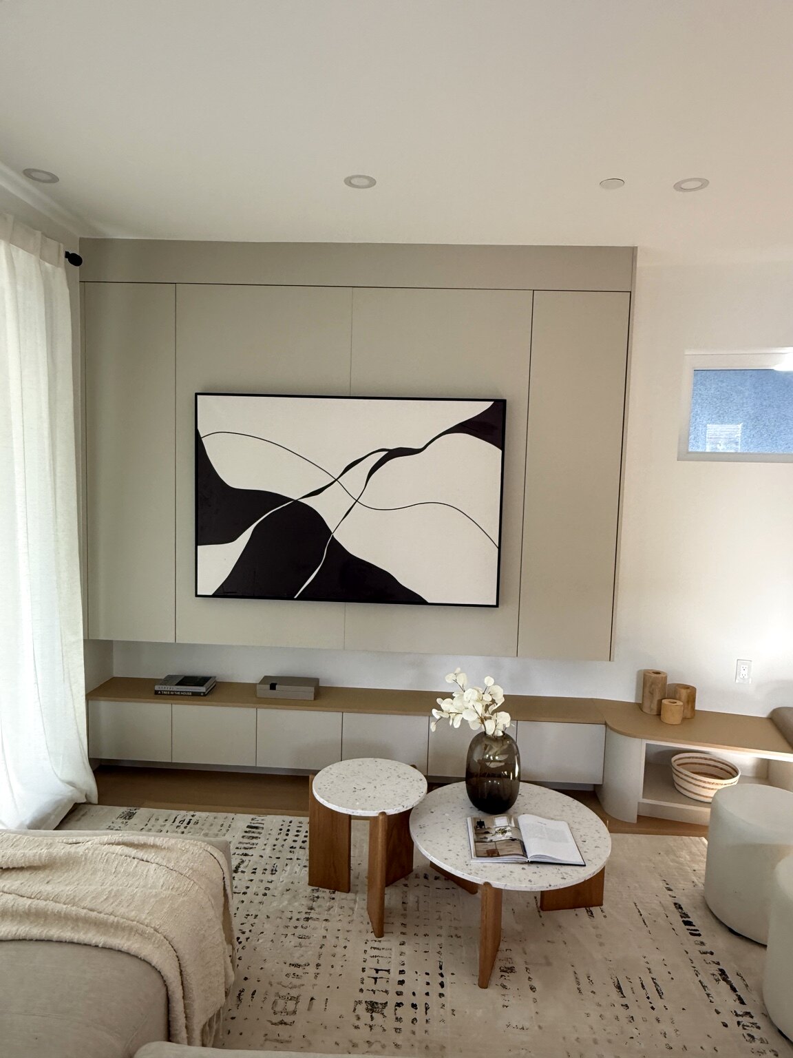 Full-height media wall and floating storage