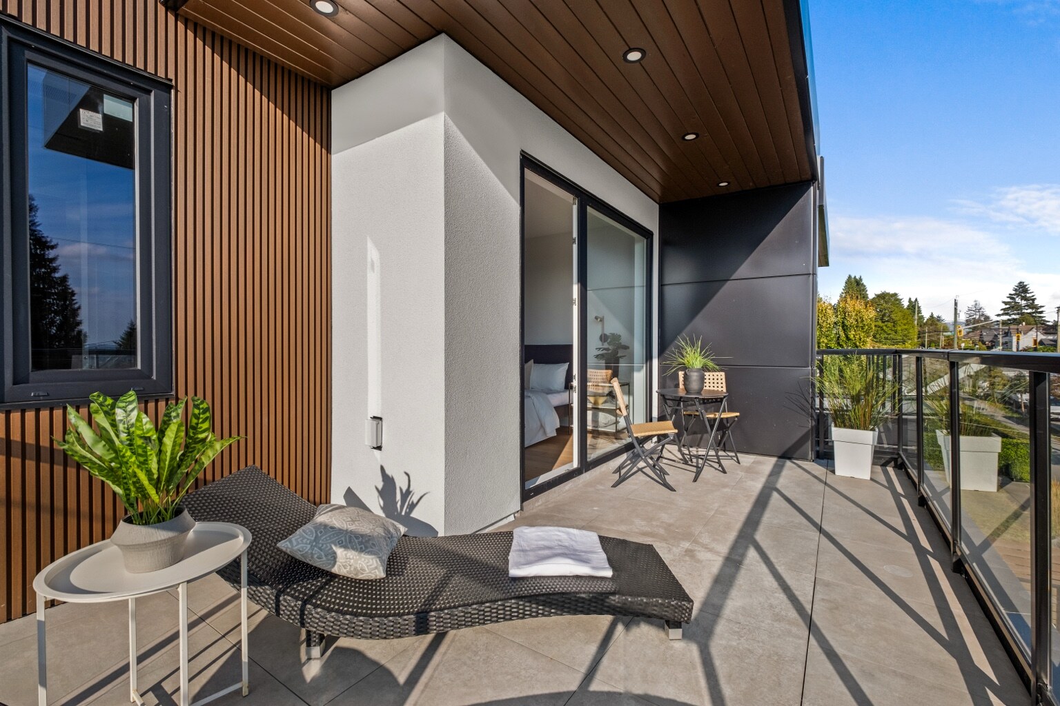 Primary bedroom patio with contemporary exterior finishes